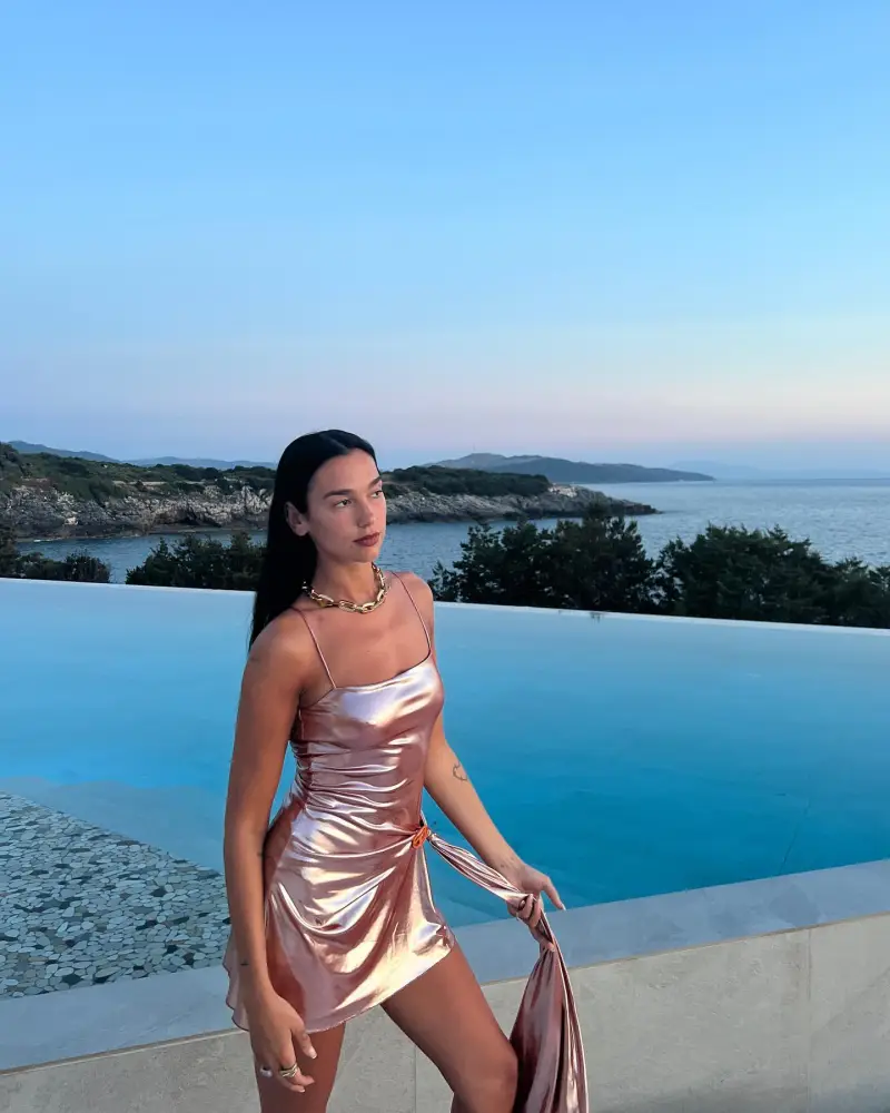 Dua Lipa's Metallic Dress Is a Chic Nod to Her Mermaid Barbie Role: 'All I Do Is Beach'