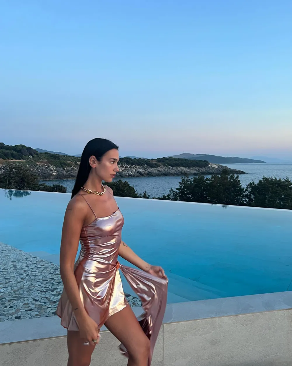 Dua Lipa's Metallic Dress Is a Chic Nod to Her Mermaid Barbie Role: 'All I Do Is Beach'