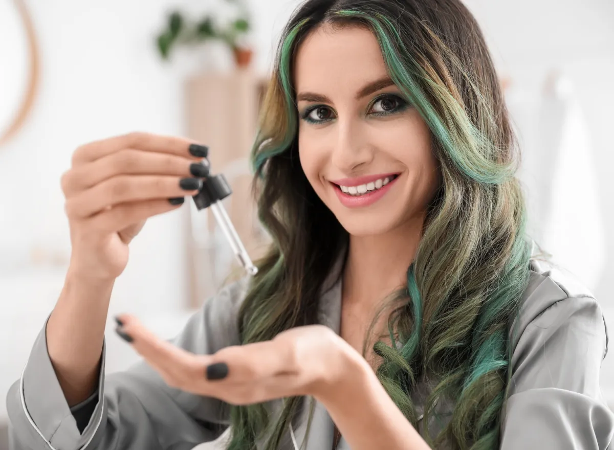 Young Woman with Serum for Hair Loss Treatment at Replica Luxury Handbag