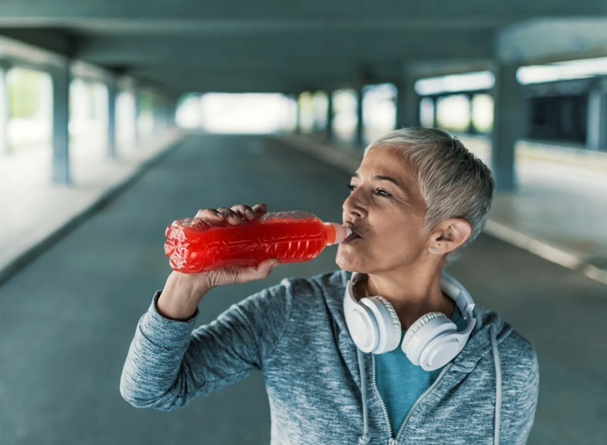 woman drinking hydration drink