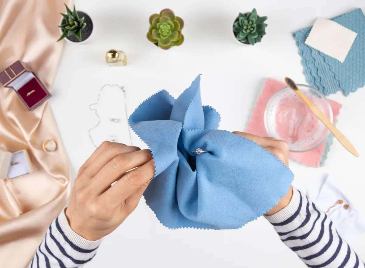 Woman cleaning her jewelry