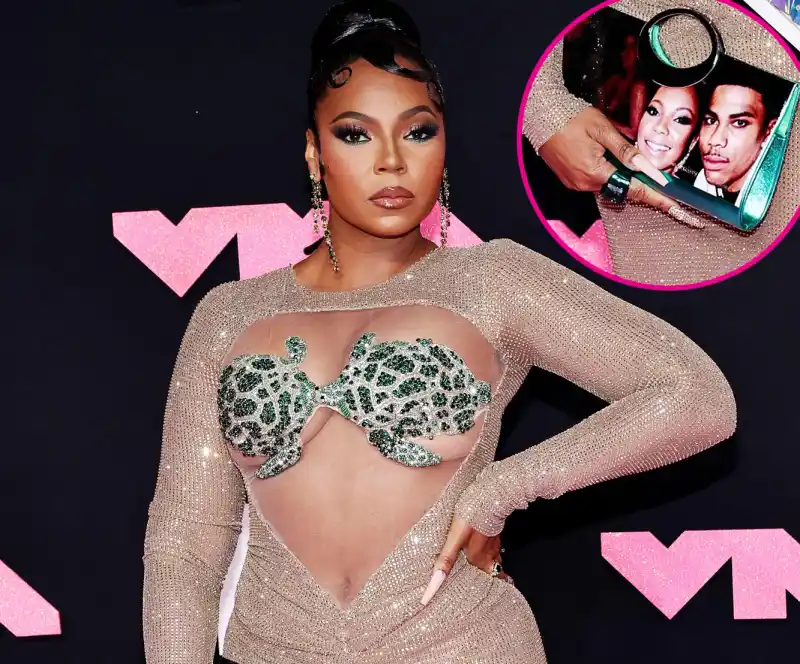 ashanti wears purse with nelly s face on it 515 520