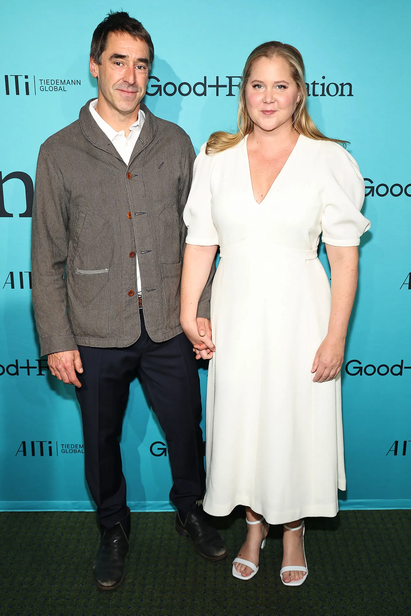 Amy Schumer and Husband Chris Fischer Hold Hands During Red Carpet Date Night