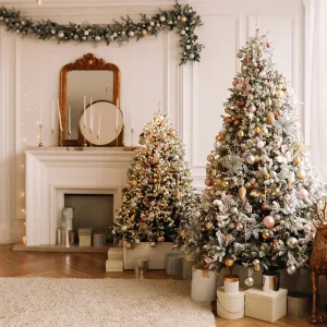 Christmas concept. Festive Christmas rich interior in a luxurious modern style with a fireplace and decorated with Christmas balls and garlands of Christmas trees in a large bright living room in the apartment on New Year's Eve in winter.