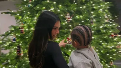 Kendall Jenner Snuggles Sister Kylie s Son Aire in Front of Christmas Tree