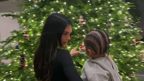 Kendall Jenner Snuggles Sister Kylie s Son Aire in Front of Christmas Tree