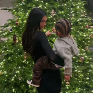 Kendall Jenner Snuggles Sister Kylie s Son Aire in Front of Christmas Tree