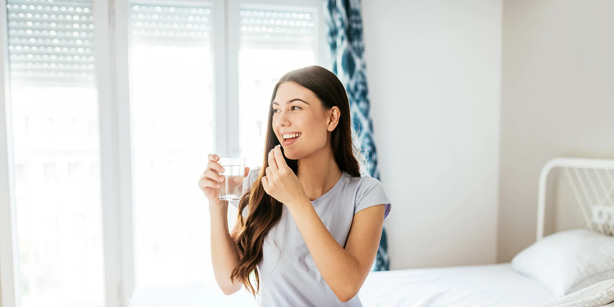 Healthy young woman taking supplements