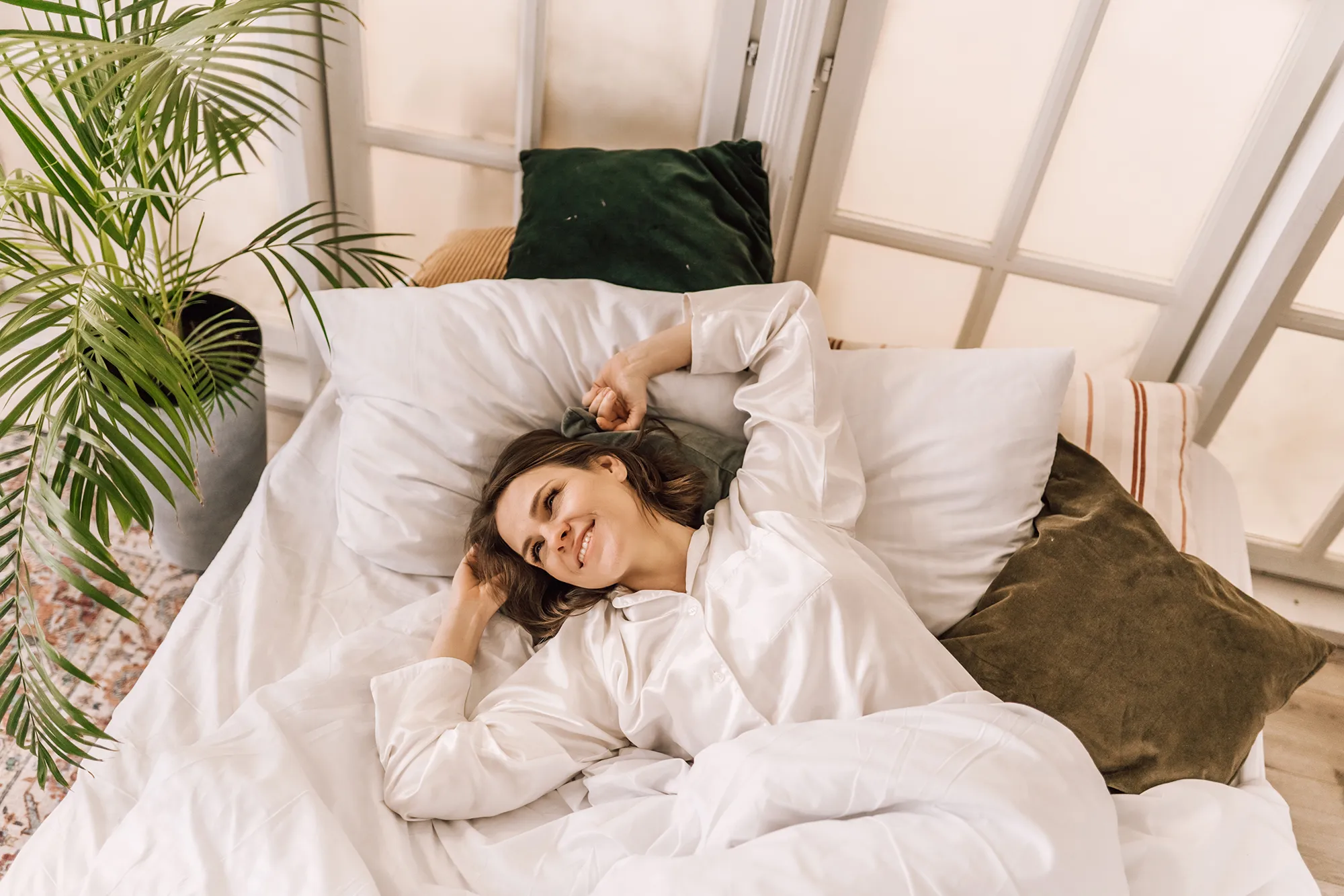 Young beautiful, woman waking up fully rested.