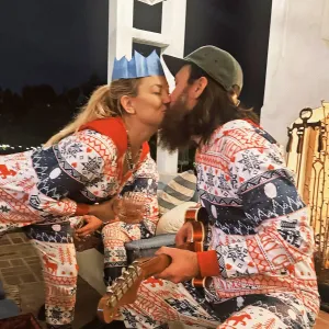 Kate Hudson Lays a Kiss on Danny Fujikawa While Matching in Festive Christmas Pajamas