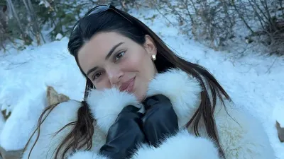 Kendall Jenner Dons a Soft Smile While Keeping Warm in a White Fur Coat in Aspen