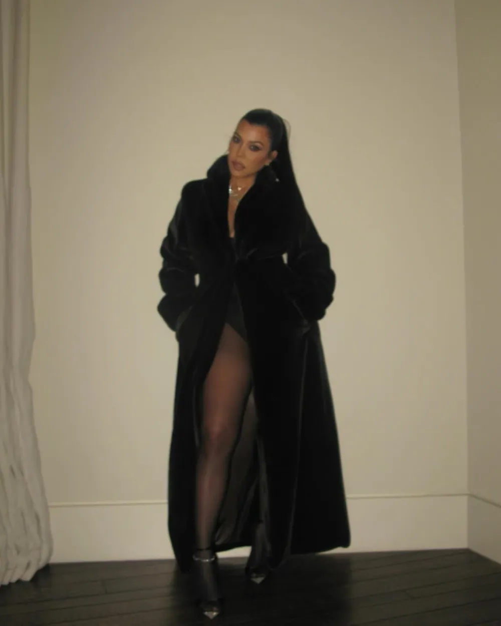 Kourtney Kardashian Threw on a Cozy Coat for Christmas Because Her Boobs Are Filled With Milk