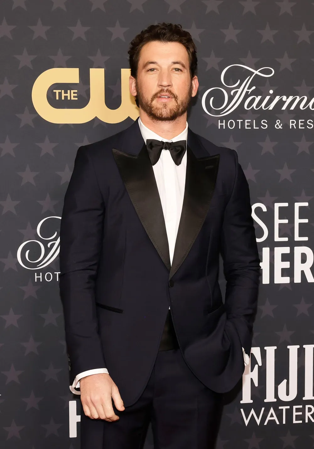 Miles Teller Holding a Baby Was Everything We Didnt Know We Needed This Holiday Season