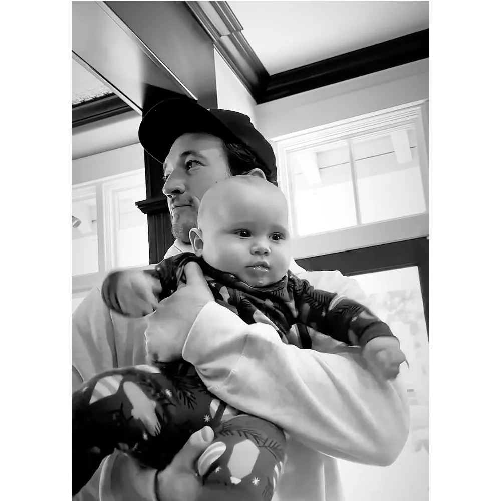 Miles Teller Holding a Baby Was Everything We Didnt Know We Needed This Holiday Season