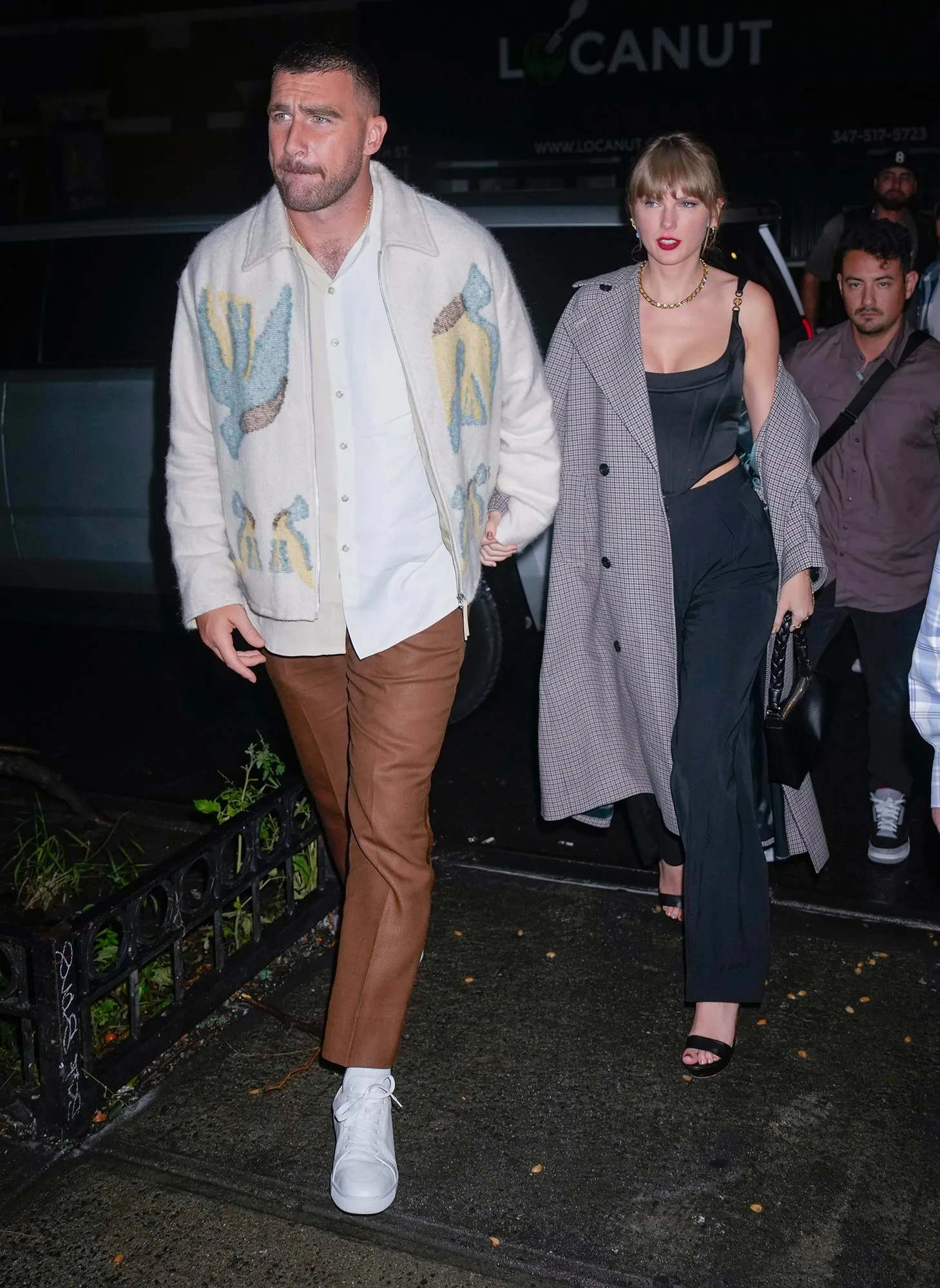 Taylor Swift and Travis Kelce Spotted at Holiday Party in Kansas City In Matching Sweaters