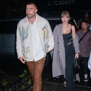Taylor Swift and Travis Kelce Spotted at Holiday Party in Kansas City In Matching Sweaters