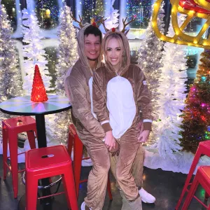 Patrick Mahomes and Wife Brittany Twin in Reindeer Onesies at 'Jolly' Holiday Bash