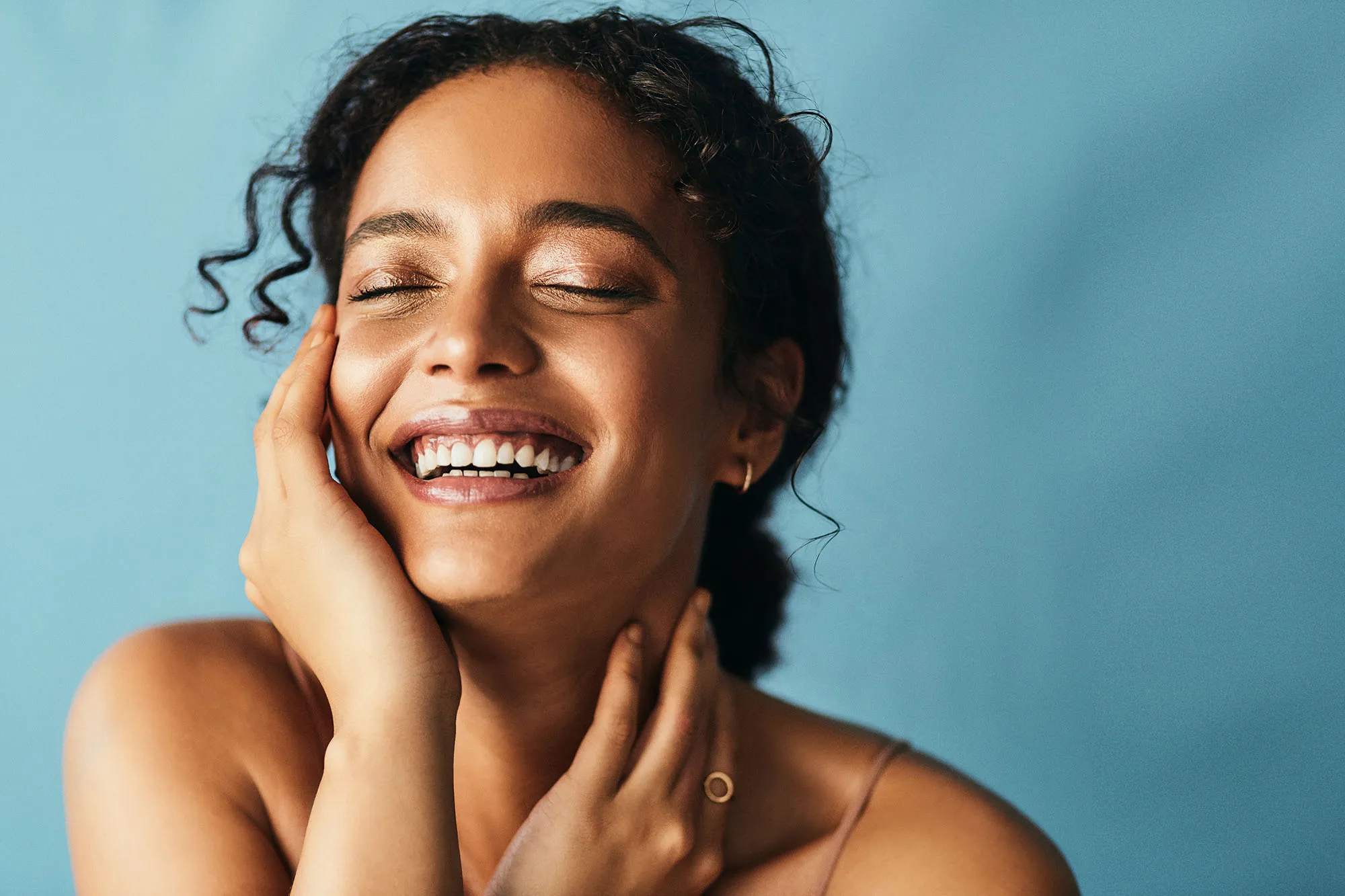Cropped shot of a beautiful young woman posing against a grey background