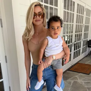 Khloe Kardashian Shows Off Hungry Son Tatum in a Food Stained Bathrobe