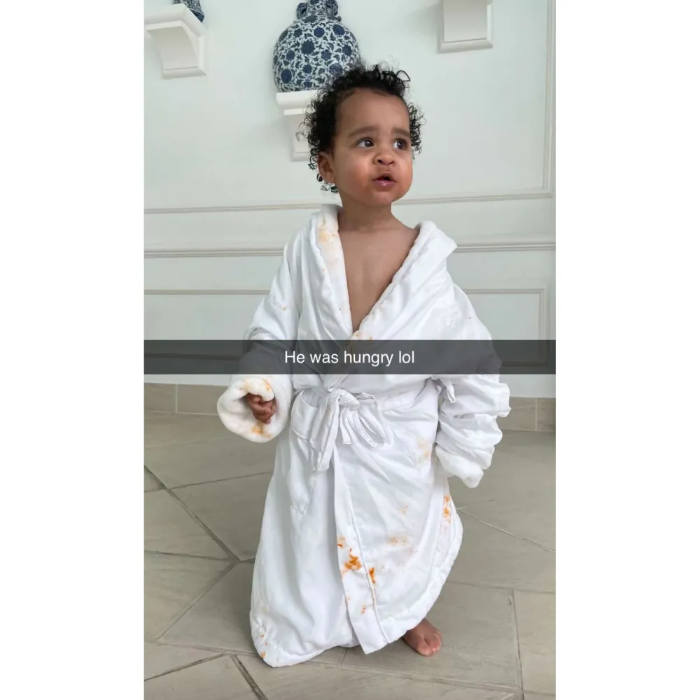 Khloe Kardashian Shows Off Hungry Son Tatum in a Food Stained Bathrobe