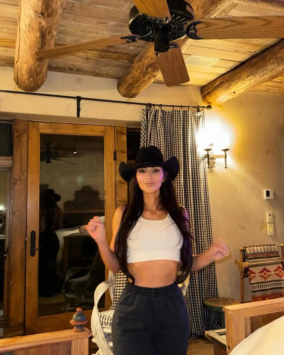 Kim Kardashian Perfectly Pairs a Cowgirl Hat With Sweatpants