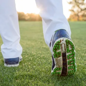 Grass sticking to shoe of golfer