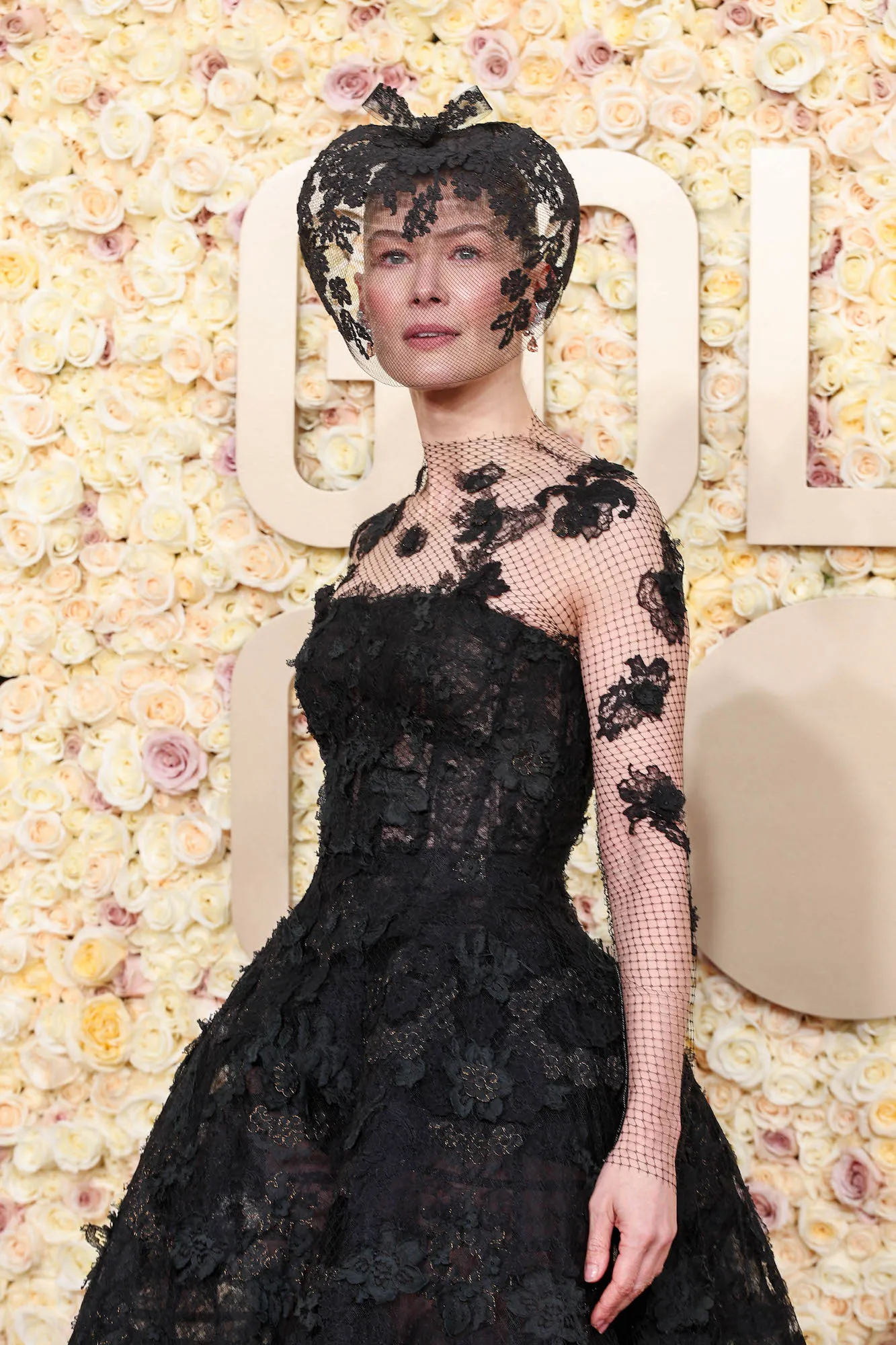 Rosamund Pike Wears Dior Veil at 2024 Golden Globes After Ski Accident