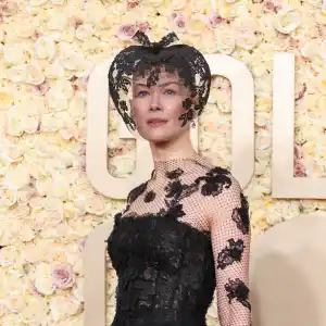 Rosamund Pike Wears Dior Veil at 2024 Golden Globes After Ski Accident
