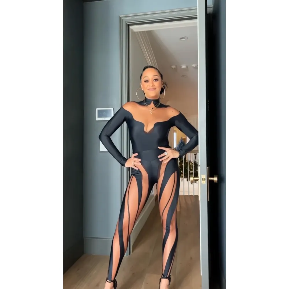 FEAT 2 Tia Mowry Struts in Cutout Catsuit