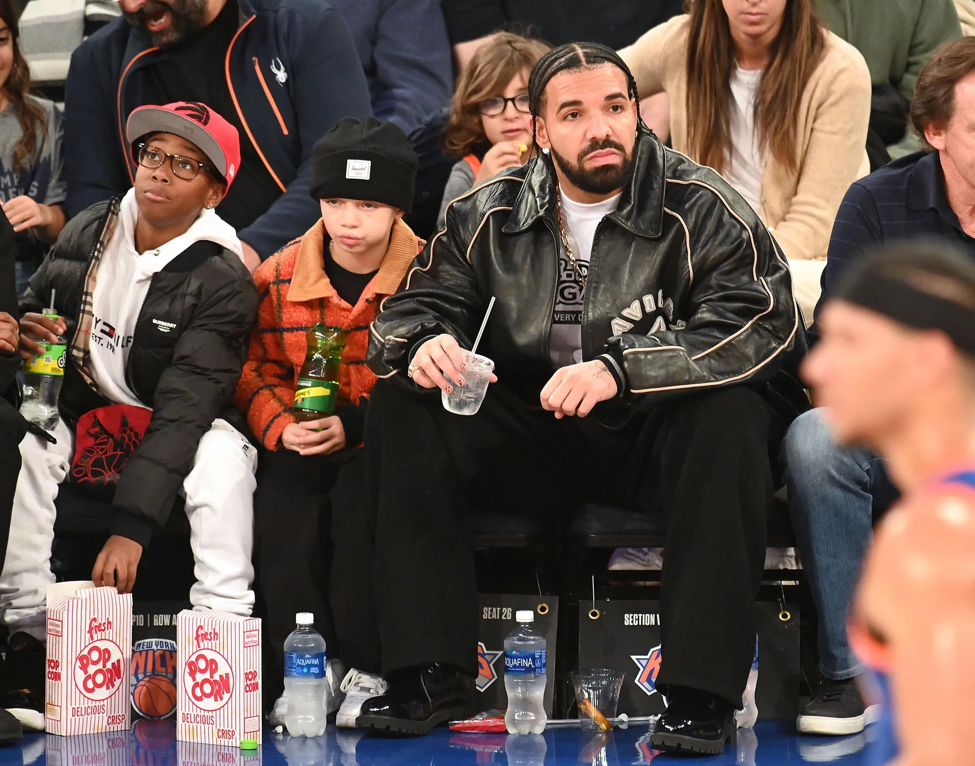 Drake and Son Adonis Sit Courtside at New York Knicks Game