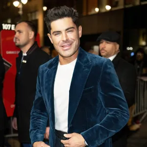 Shirtless Zac Efron Cuddling a Dog Is Exactly What You Need to See to Ward Off Sunday Scaries