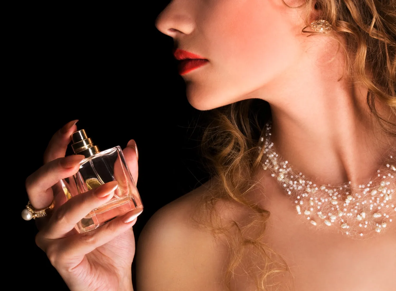 Woman holding perfume