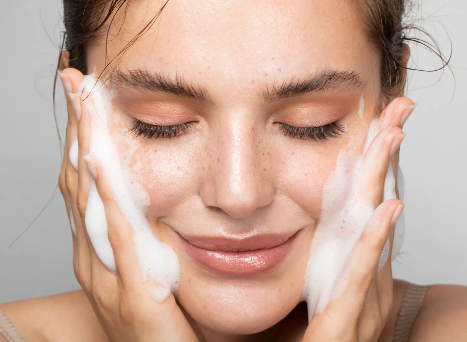 Woman washing her face