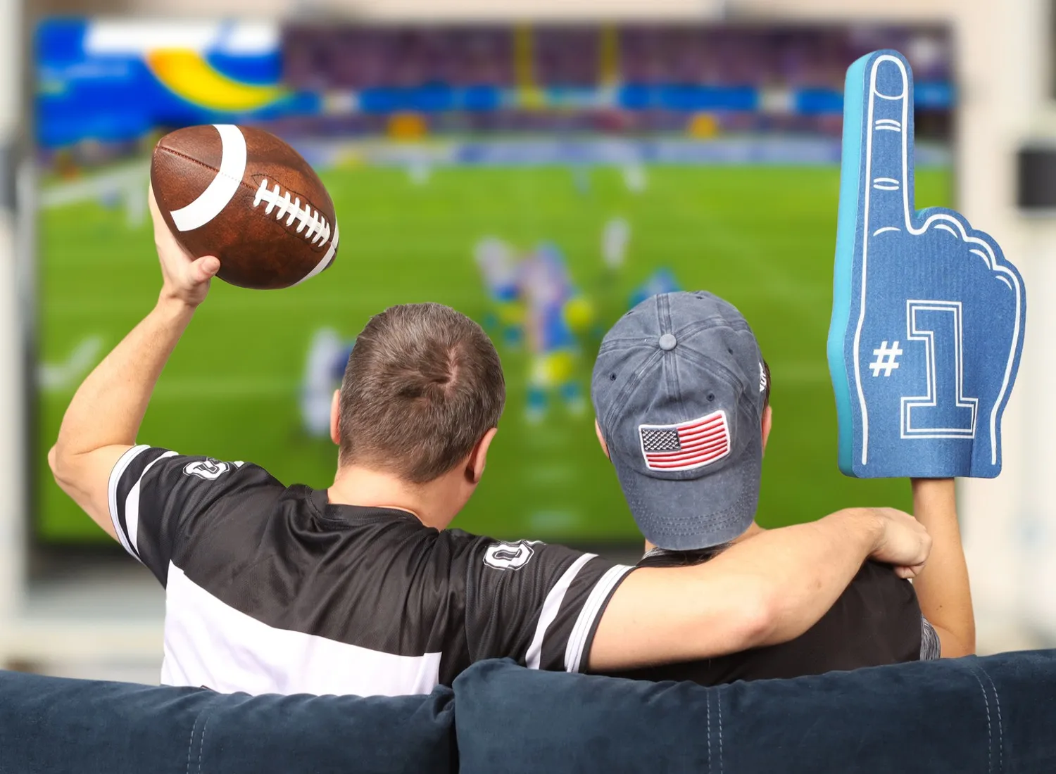 Father and son watching football