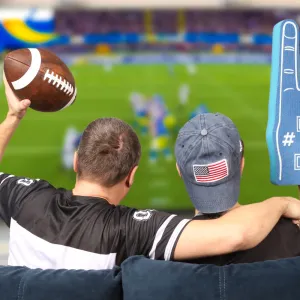 Father and son watching football