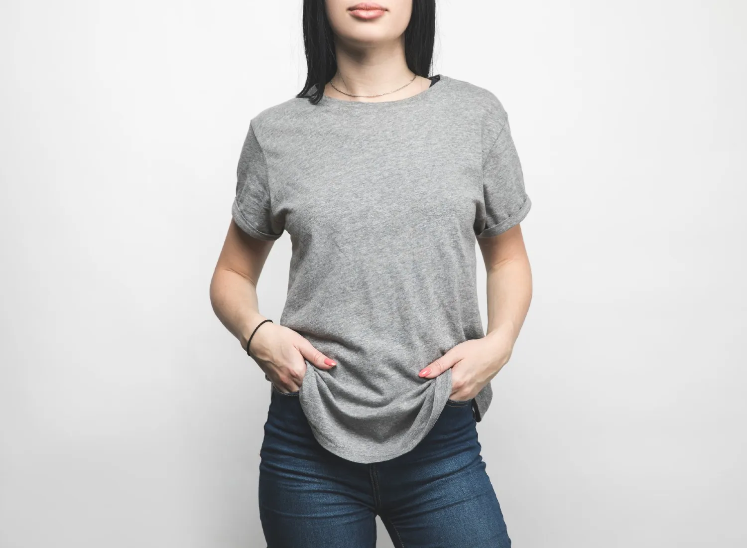 Woman wearing an oversized grey t-shirt
