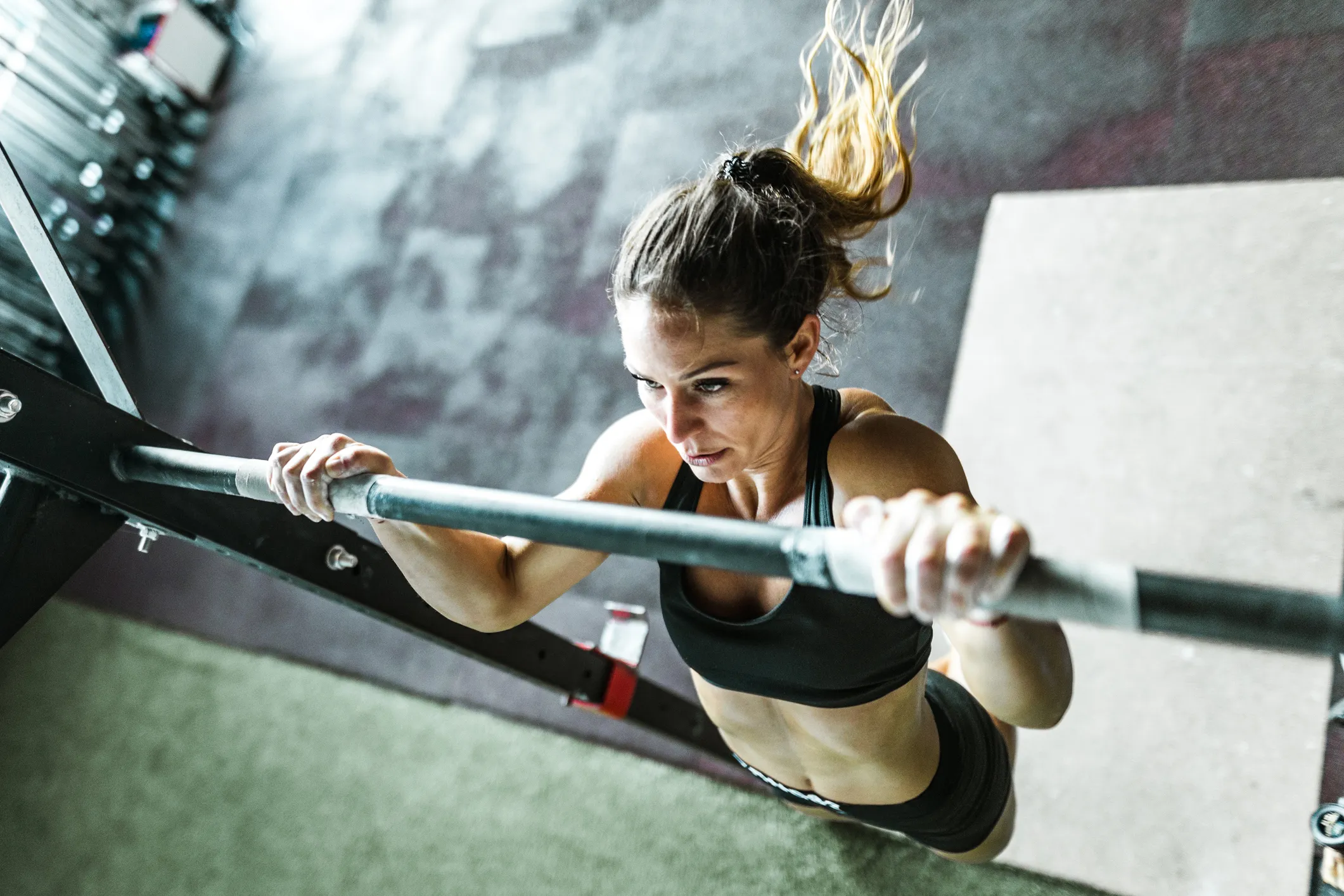 Woman exercising with chin-ups