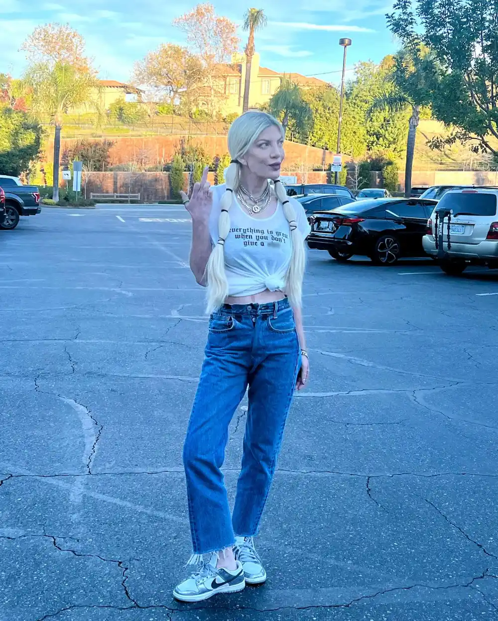 Tori Spelling Sends a Clear Message With Middle Finger Pic and T-Shirt About Not Giving 'A S&ndash;t'