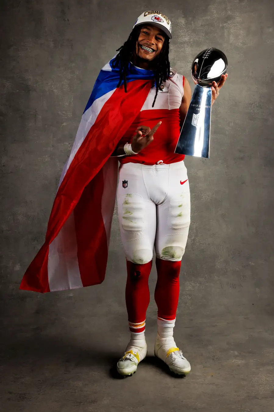 Isiah Pacheco Kansas City Chiefs Players Kiss Vince Lombardi Trophy in Super Bowl LVIII Winners Portraits