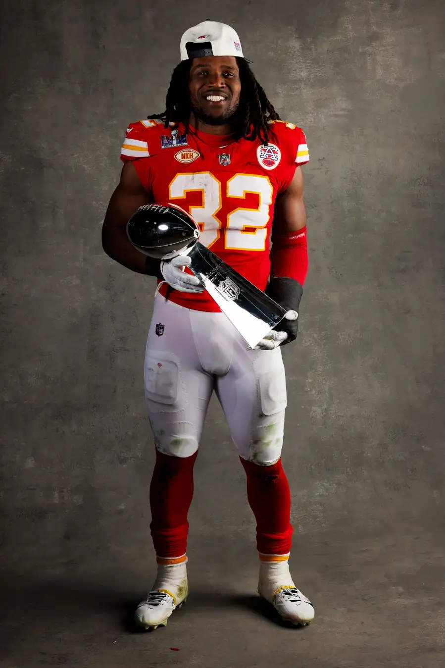 Nick Bolton Kansas City Chiefs Players Kiss Vince Lombardi Trophy in Super Bowl LVIII Winners Portraits