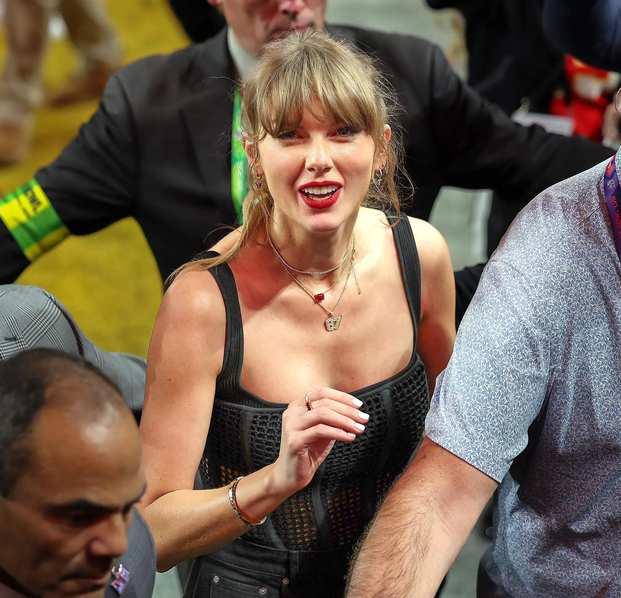 Taylor Swift Gives a Sweet Nod to Travis Kelce With ‘87’ Boots and Bejeweled Football Purse