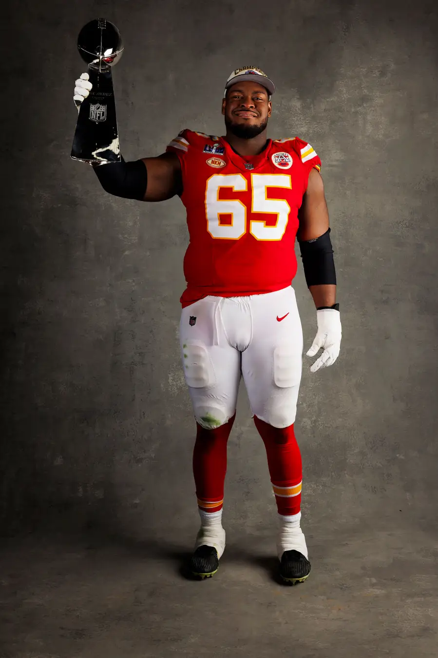 Trey Smith Kansas City Chiefs Players Kiss Vince Lombardi Trophy in Super Bowl LVIII Winners Portraits