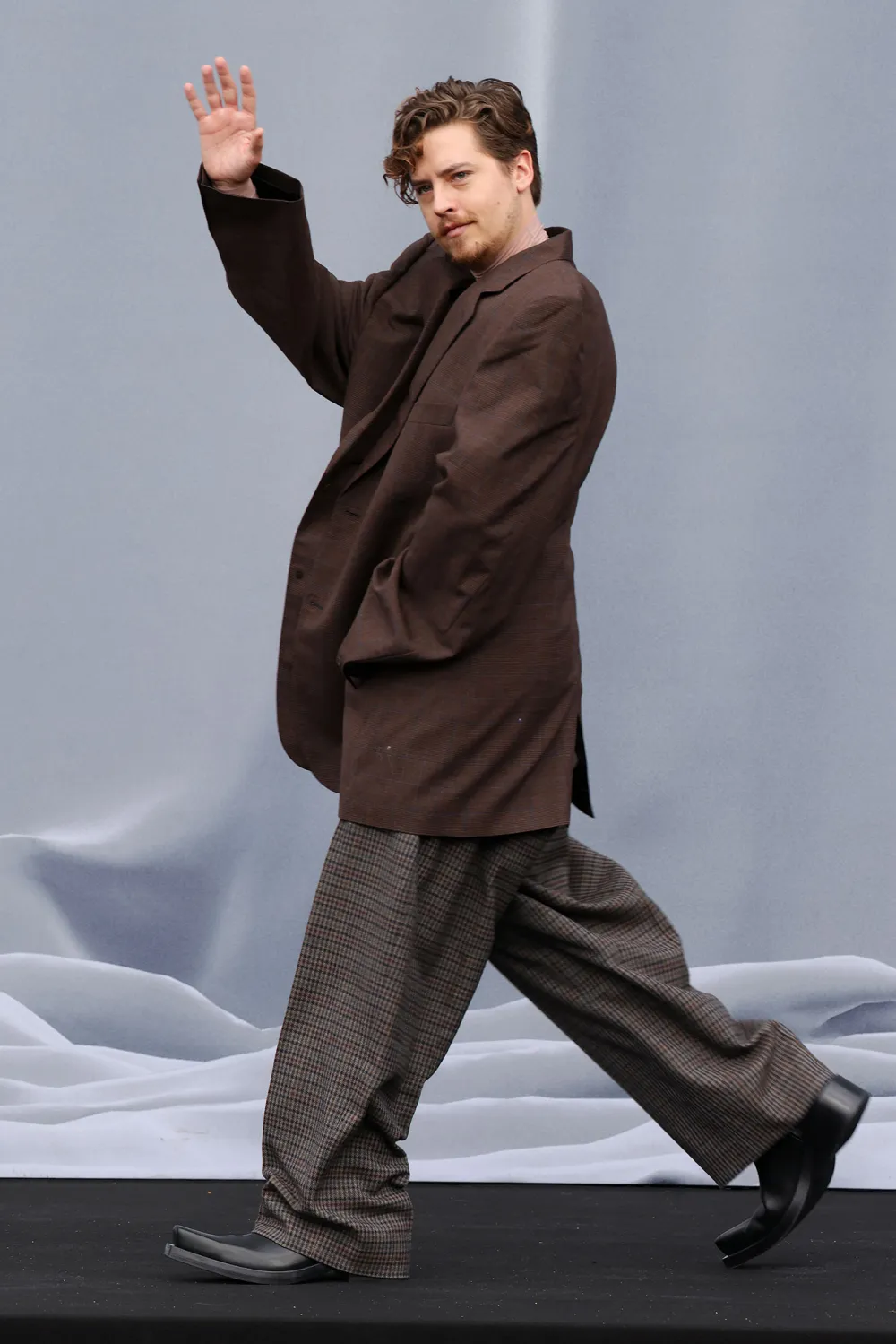 Cole Sprouse Channels the 80s in Oversized Blazer and Shoulder Pads at Paris Fashion Week