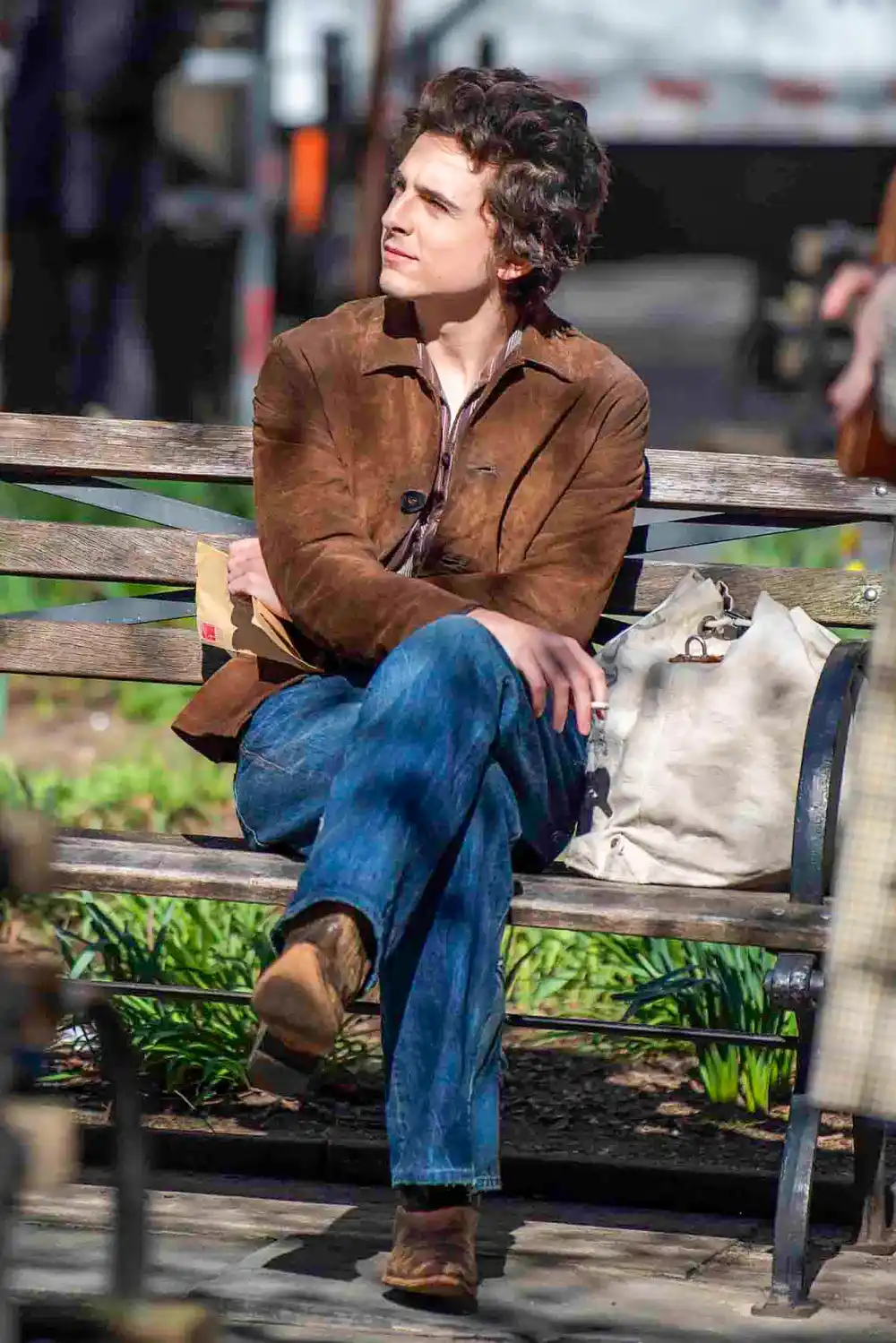 Timothee Chalamet Transforms Into Bob Dylan In Iconic Brown Suede Jacket and Sunglasses 2