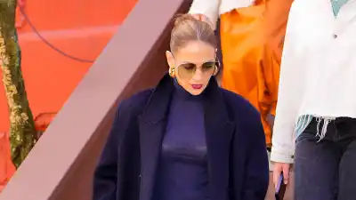 Feature Jennifer Lopez Elevates Faded Baggy Jeans With a Fitted Turtleneck and Sleek Up-Do