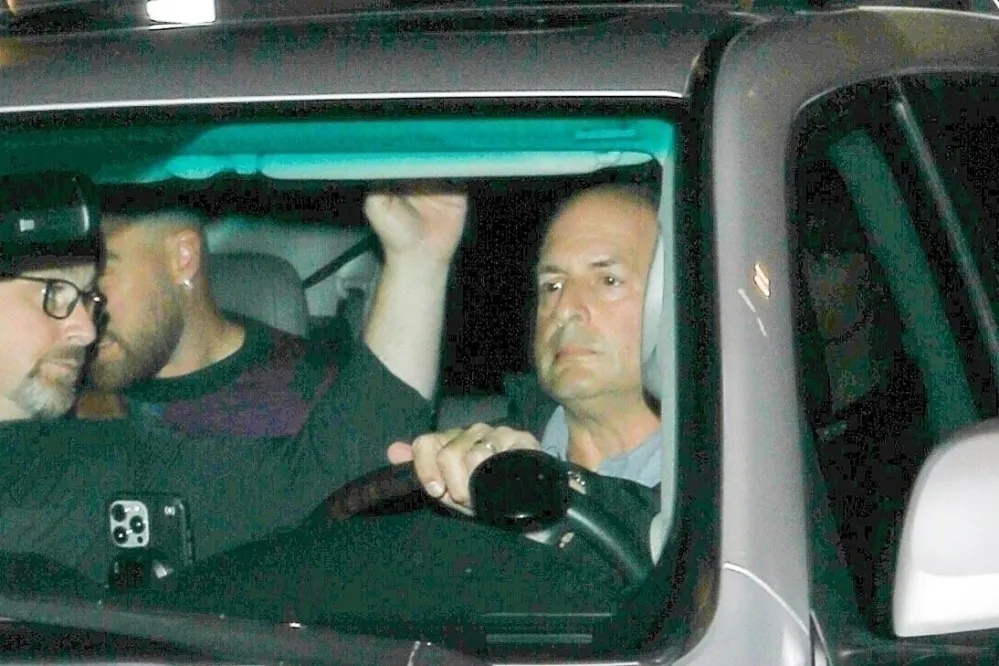 Taylor Swift and Travis Kelce Hide Behind White Sheet During Date Night 536