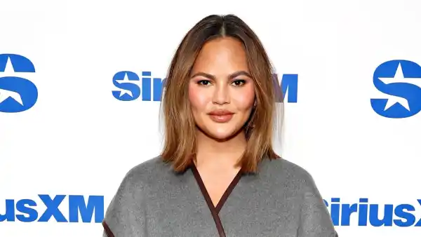 Chrissy Teigen Sleeps on Dubai Airport Floor With Family
