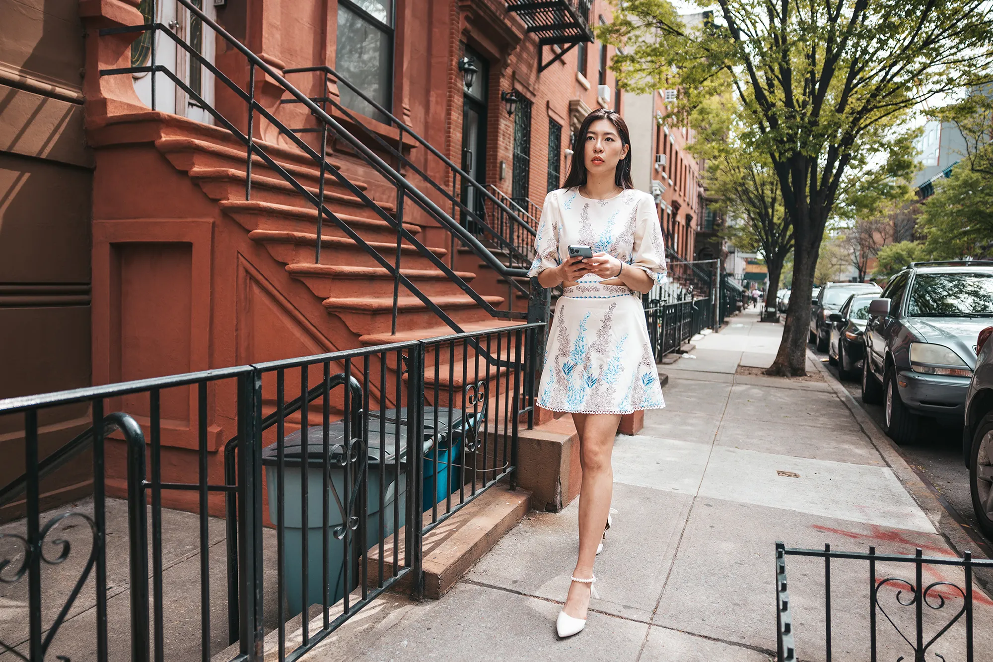 Young woman walking in the city street.