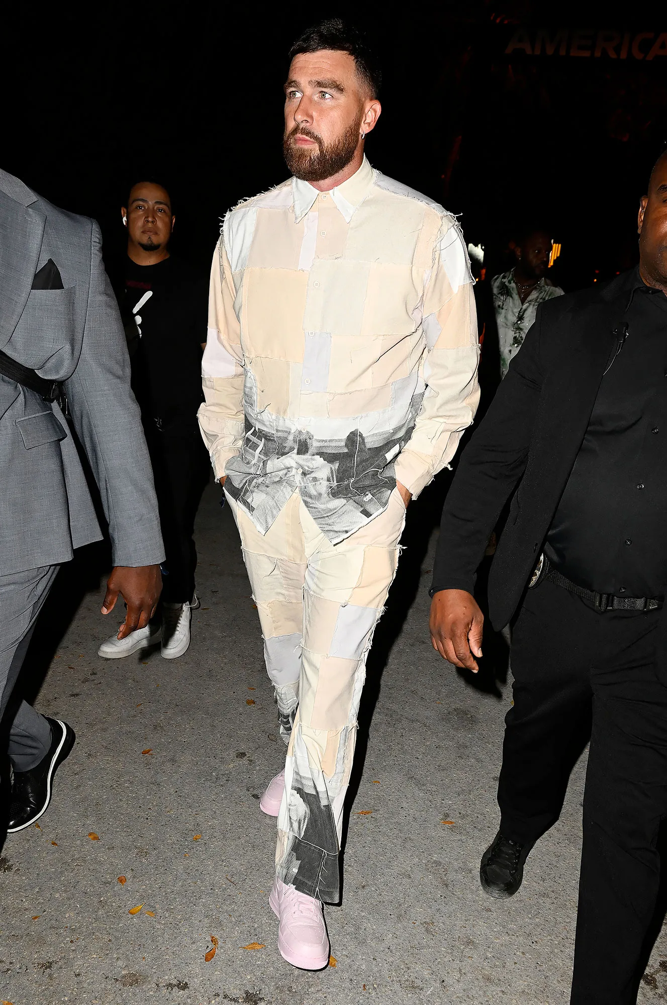 Feature Travis Kelce Attends F1 Miami Grand Prix Party in Patchwork Two-Piece Set and Pink Sneakers