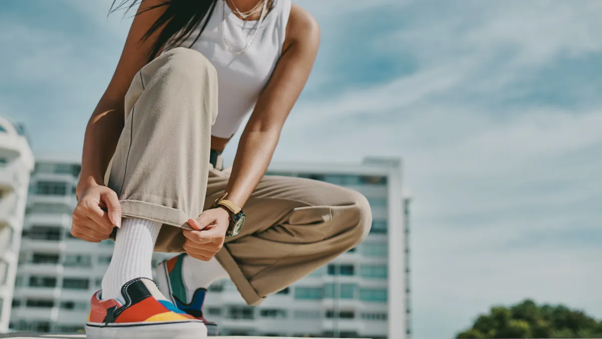 A woman checking out her shoe.